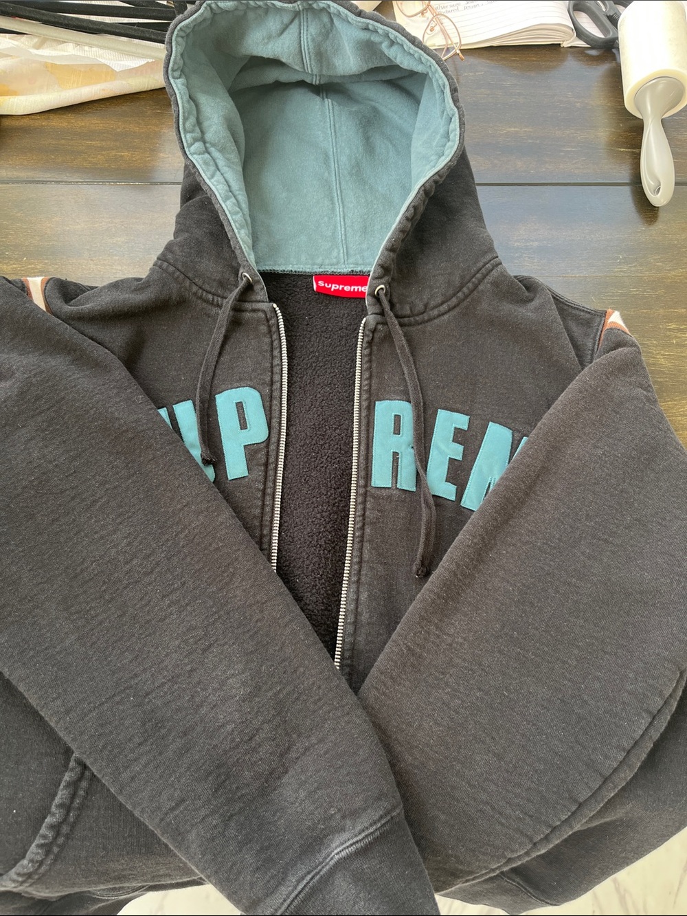 Supreme Black Split Logo zip up Hoodie with Teal Lettering, Made in Canada.